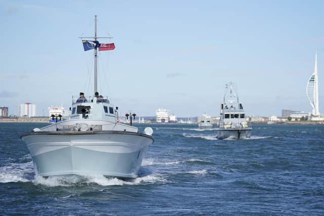 MTB 81, a Second World War Coastal Forces motor gun boat, left, and Royal Navy Archer class patrol vessel HMS Puncher make their way out into the Solent Picture: Andrew Matthews/PA Wire