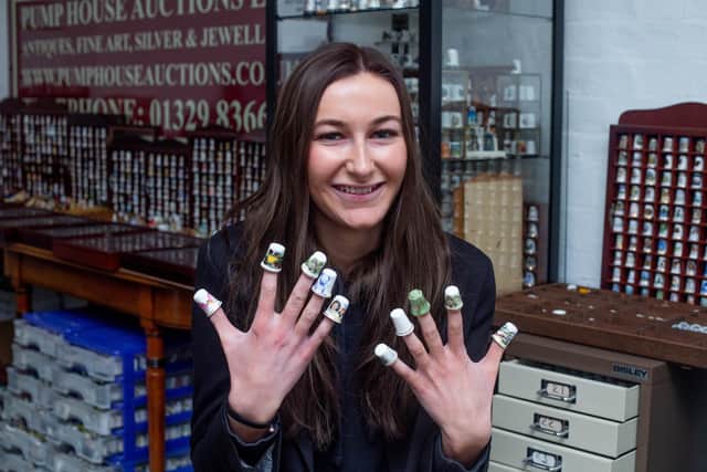 Head of marketing, Mabel Taylor with some of the thimbles at Pump House Auctions