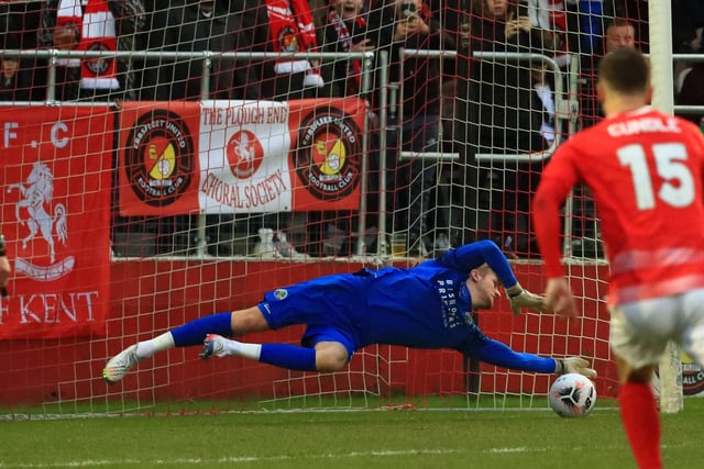 Hawks loanee keeper Teddy Sharman-Lowe saves Rakish Bingham's spot-kick. Picture by Dave Haines