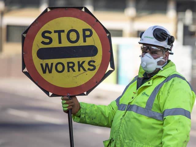 Businesses in Hampshire are being thrown a lifeline by the Solent LEP to help them survive the Coronavirus crisis. Pictured is a construction worker wearing masks. Photo by Dan Kitwood/Getty Images