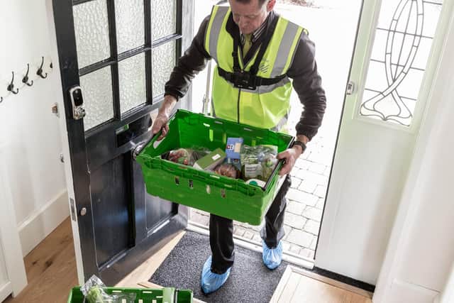 A Waitrose home delivery driver. Picture: Waitrose/PA Wire