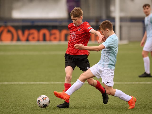 Action from the Portsmouth Youth League Geldard Invitation Cup final between Jubilee 77 U13s and Castle United U13s (light blue and white kit). Picture: Keith Woodland (190321-466)