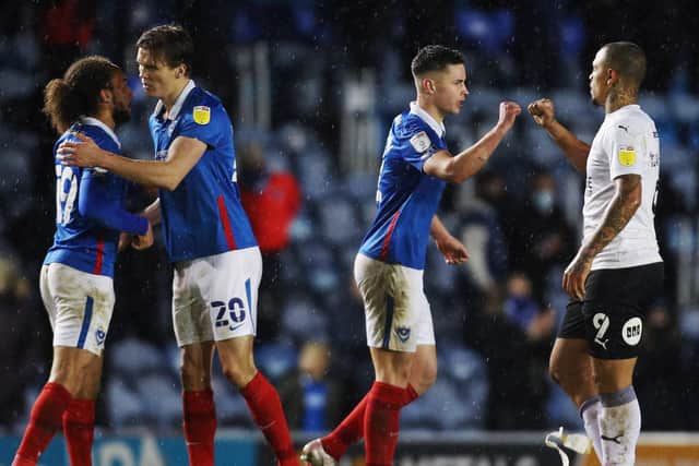 Pompey's Marcus Harness, Sean Raggett and Callum Johnson after the win over Peterborough. Picture: Joe Pepler
