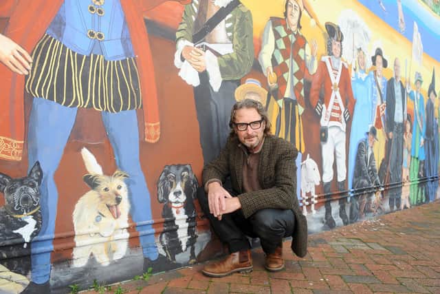 Artist Mark Lewis at the Strand mural at the junction of Waverley Road and Clarendon Road in Southsea. Picture: Sarah Standing (171120-8698)