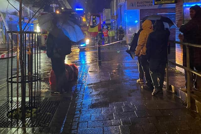 A shocked crowd gathered to watch firefighters tackling the blaze. Picture: Max Lewis.