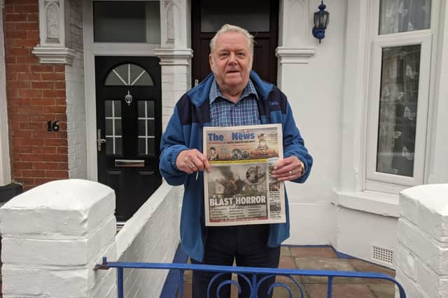Michael Knight, Nelson Avenue resident, holding a copy of today's The News with our report of the blast on the front page