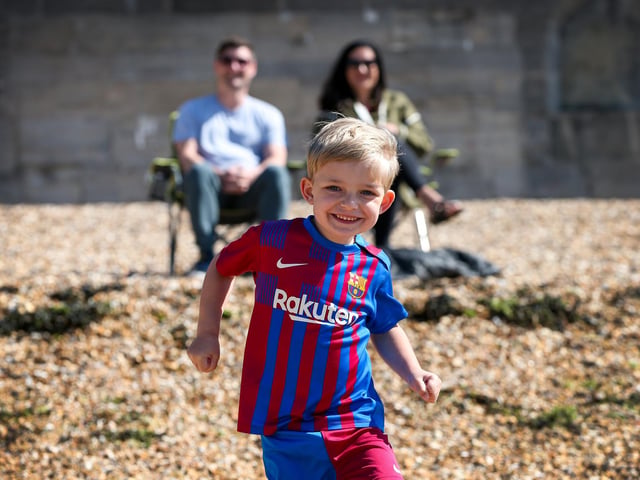 Thomas Clegg, 4, with his parents Richard and Mellony Clegg on a sunny Saturday morning in Old Portsmouth. Picture: Chris Moorhouse (250524-06)