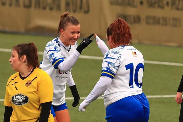 Sarah Butterworth, left, celebrates her hat-trick goal with Chloe Dark. Picture by Dave Haines