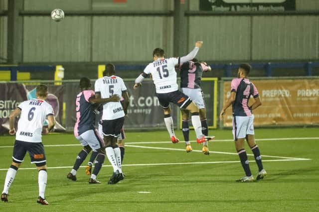 Craig Robson rises high to head in Hawks' third goal against Dulwich. Picture: Dave Haines.