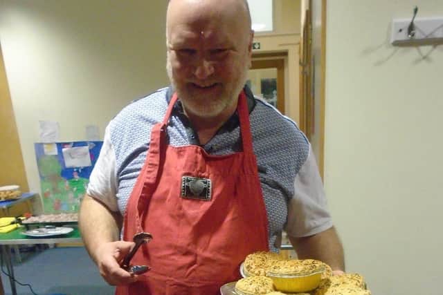 Volunteer with the food donations from Portsmouth FC