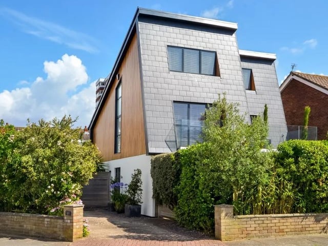 This property has five bedrooms, four bathrooms and two reception rooms.