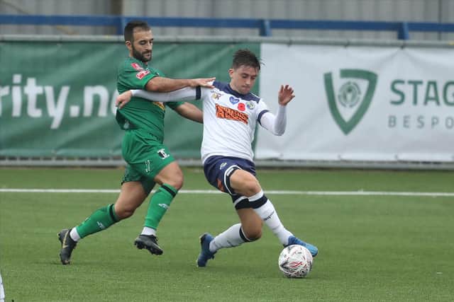 Benny Read battles with Kieron McCann during the FA Cup first round win against Cray Valley. Hawks earned £12,500 from the BBC for having that tie streamed, and will bank a further £37,500 from the second round visit to Marine being shown live on BT Sport.Photo by Dave Haines.
