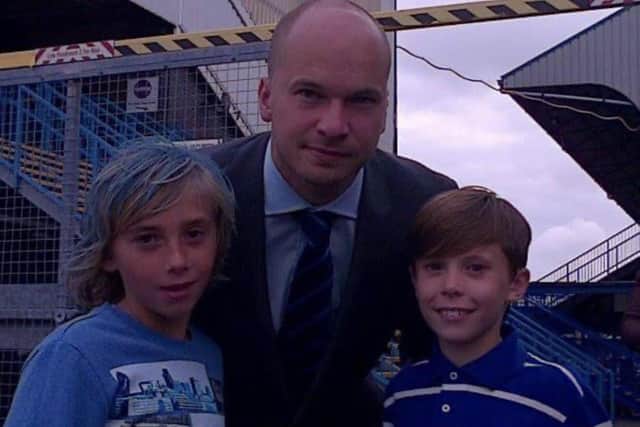 Charlie Bell, far left, meets Pompey goalkeeper Phil Smith in 2013