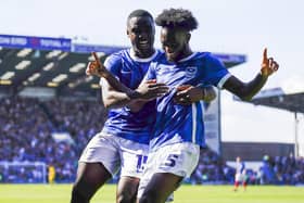 Abu Kamara celebrates with Christian Saydee after netting his first Pompey goal in the 3-1 win over Peterborough. Picture: Jason Brown/ProSportsImages