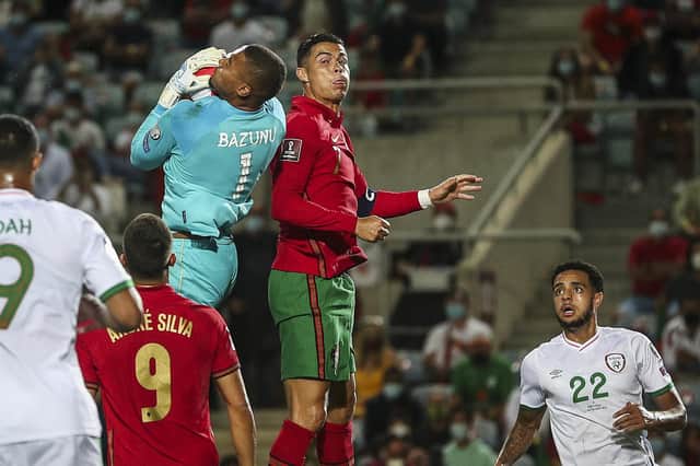 Gavin Bazunu challenges Cristiano Ronaldo in Wednesday night's eventful World Cup qualifier. Picture: Carlos Costa/AFP via Getty Images