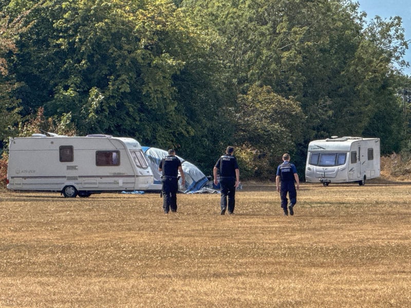 Travellers get a dusty welcome at a field in Rowner, Gosport on Monday. Gosport council vehicles surrounded the area shortly after the first caravans arrived to block further access.