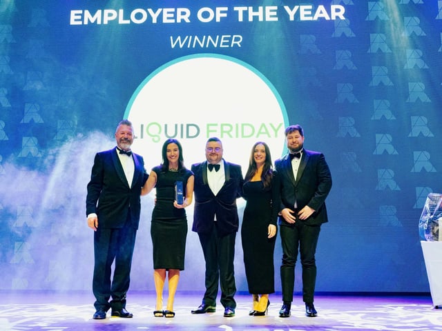 Mark Collins with the winners of Employer of the Year Liquid Friday.  Picture: Keith Woodland (270321-190)