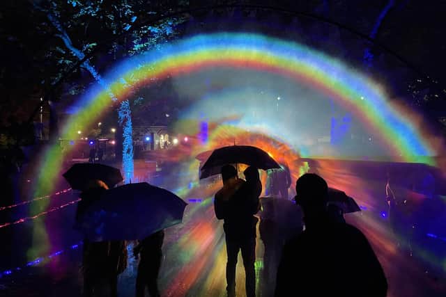People enjoy the Rainbow in the Dark light installation in Portsmouth as part of the We Shine Portsmouth light Festival. Picture: Ben Mitchell/PA Wire