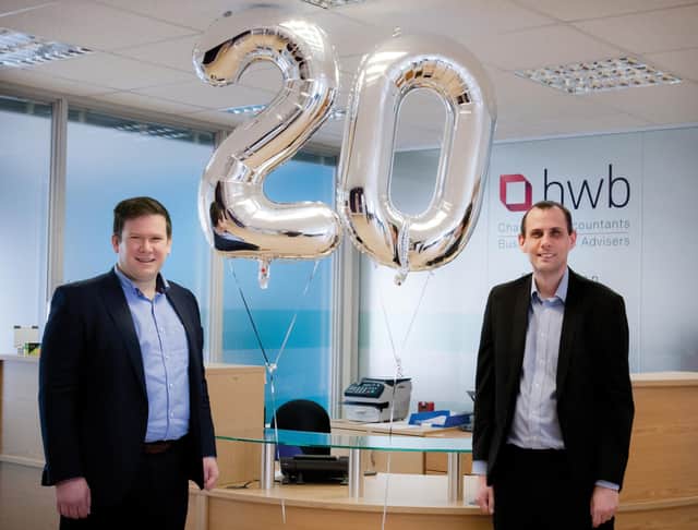 Associate Director Andrew Kershaw and Business Adviser Chris Wignall celebrate 20 years at HWB.