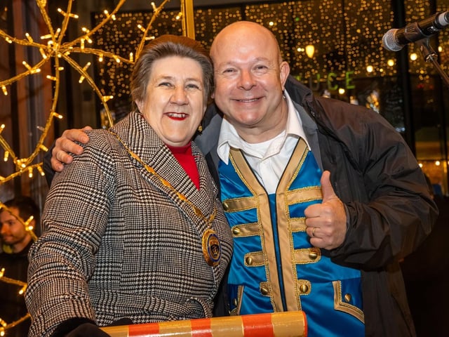 The crowds braved the wind and rain to watch the Christmas lights being switched on in Fareham highstreet on Saturday evening, while some of the entertainment was moved into the shopping centre.
Pictured - Mayoress Cllr Louise Clubley with Paul Burling, playing Buttons in Cinderella at Fareham Live
Photos by Alex Shute