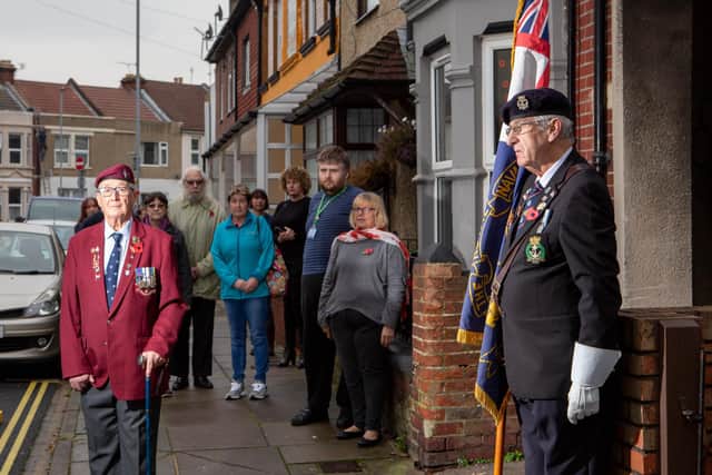 Andy Long and Clive Sutton with family and neigbours in Stamshaw Road, Portsmouth, to mark Remembrance Sunday during lockdown.

Picture: Habibur Rahman