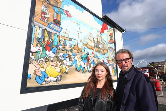 Artist Mark Lewis and his daughter Jesma who painted a new mural on the side of the Bridge Tavern, Old Portsmouth.
Picture: Stuart Martin (220421-7042)