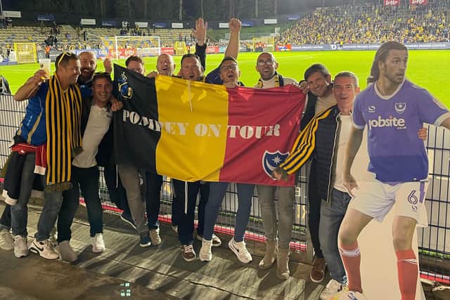 Russell Eke and nine other Pompey fans made the trip to Belgium to watch Christian Burgess in action - and took a cardboard cut-out