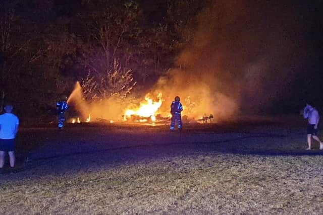 A caravan was destroyed in a fire at Port Solent where a traveller encampment sprang up. The fire on August 5 was tackled by Cosham and Portchester crews. Picture: Portchester fire station