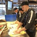 The new Domino's Pizza store that has opened in Winston Churchill Avenue in Portsmouth. Portsmouth FC players Craig MacGillivray and Bryn Morris got to go behind the scenes and learn how to make a pizza. 