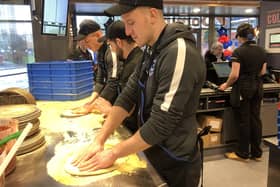 The new Domino's Pizza store that has opened in Winston Churchill Avenue in Portsmouth. Portsmouth FC players Craig MacGillivray and Bryn Morris got to go behind the scenes and learn how to make a pizza. 