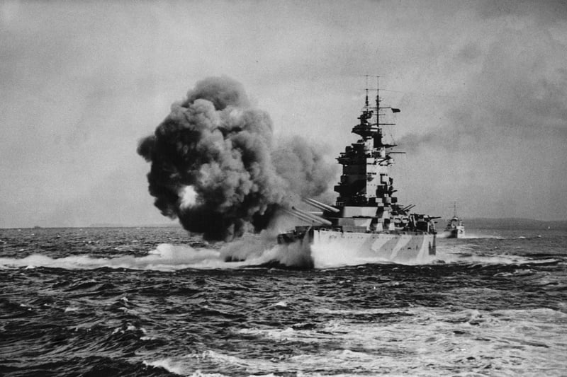 The Royal Navy Nelson-class battleship HMS Nelson, named in honour of Horatio Nelson, 1st Viscount Nelson the victor at the Battle of Trafalgar, fires a full broadside with her nine16-inch (406 mm) guns known as Happy, Grumpy, Sneezy, Dopey, Sleepy, Bashful, Doc, Mickey and Minnie after the characters in the film Snow White whilst on operations in the Mediterranean as part of Force H on 1 August 1942 in the Mediterranean near Gibralter. (Photo by Keystone/Hulton Archive/Getty Images).