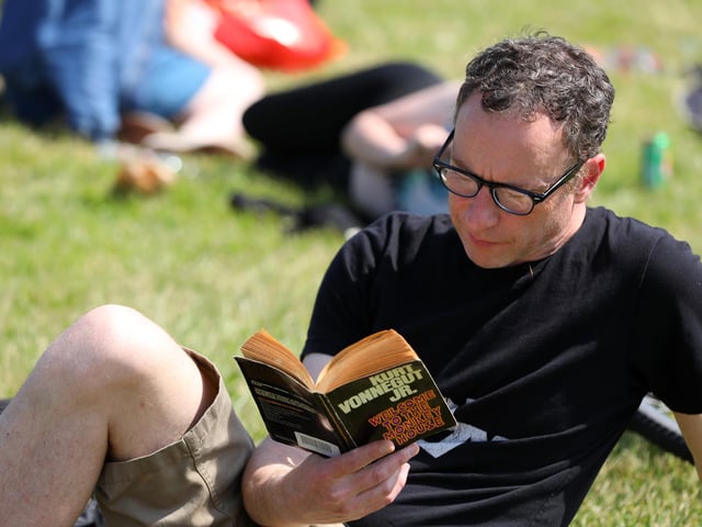 Reading while waiting for another band to come on. Live at the Bandstand, Castle Field, Southsea
Picture: Chris Moorhouse (jpns 270523-39)