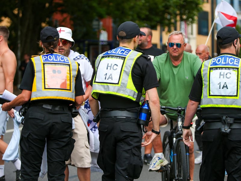 Protestors at Guildhall Square, Portsmouth. Demonstrators having verbal exchanges with officers. Picture: Chris  Moorhouse (030824-55)