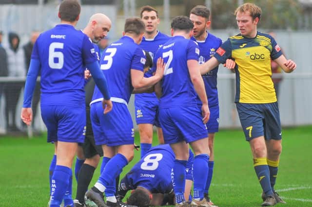 Baffins skipper James Cowan is down injured after a foul which led to a booking for Moneyfields' Callum Glen. Picture: Martyn White