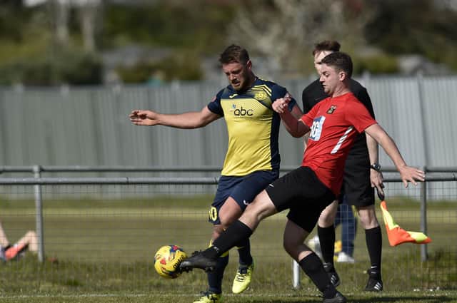 Ethan Jones, right, fired home in the shoot-out Fareham's penalties win over Brockenhurst. Picture: Allan Hutchings (030421-289)