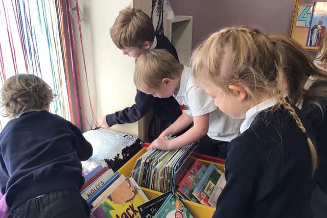 Youngsters enjoying the library's selection of books