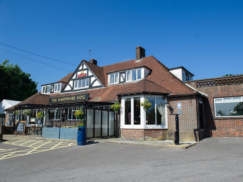 The Hampshire Hog in London Road, Clanfield, has a real fire, according the Fullers website.