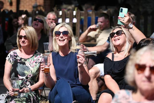 From left, Debbie Henley, Carrie Clarkson and Danielle Tanner are loving the band. Beer festival at the Ship and Bell, Horndean. Picture: Chris Moorhouse  (jpns 280821-13)