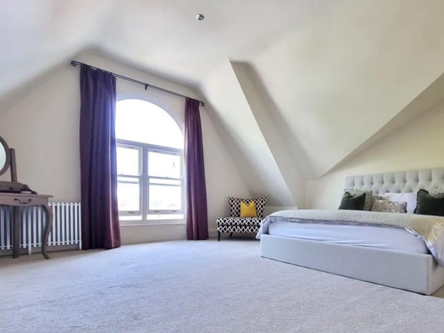 The listing says: "It represents the primary third of a substantial Victorian villa which was converted in approximately 2001 and is concealed behind high rendered walls and a remote control gateway, which leads to an area of off-road car parking for 2 cars."