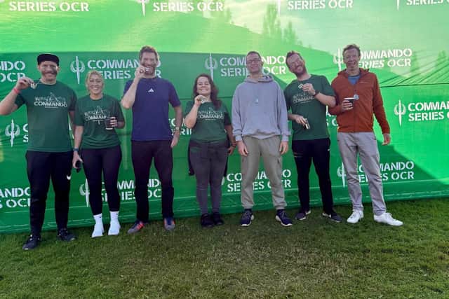 At the finish line: Daniel Botting, far right, upon completion of the Commando challenge to raise money.