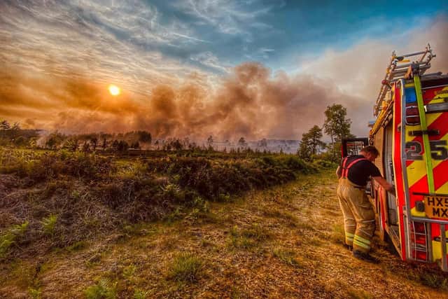 A firefighter on the scene of the Longmoor Camp blaze.