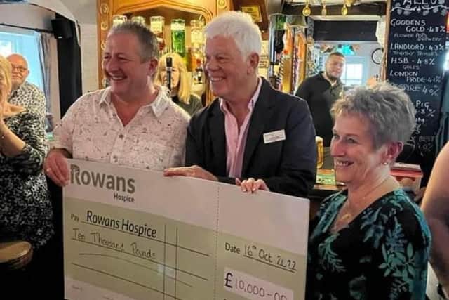 Landlord Andrew Munday, left, Rowans trustee Geoff Page and landlady Alison Munden
