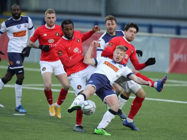 Tommy Wright is closely watched by Ebbsfleet defenders. Photo by Dave Haines