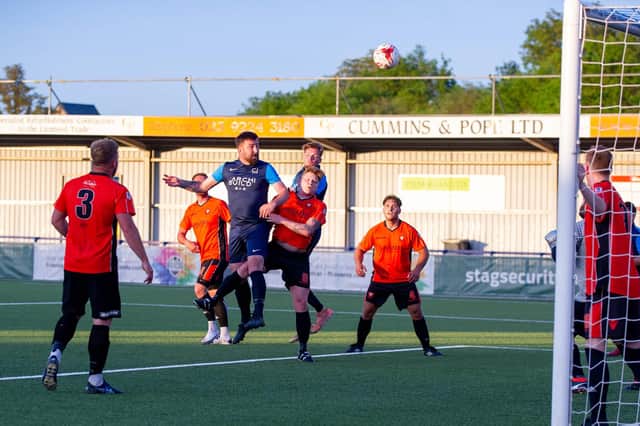 Charlie Wakefield rises high to head in for CJ Glass against AFC Portchester. Picture: Habibur Rahman