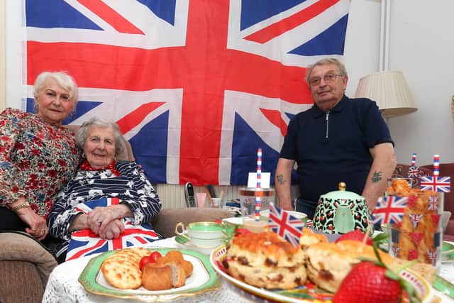 Eunice Forhead, 109, enjoys the King's coronation. She is pictured with her nephew, Johnny Good, and his wife, Frances.
Picture: Chris Moorhouse