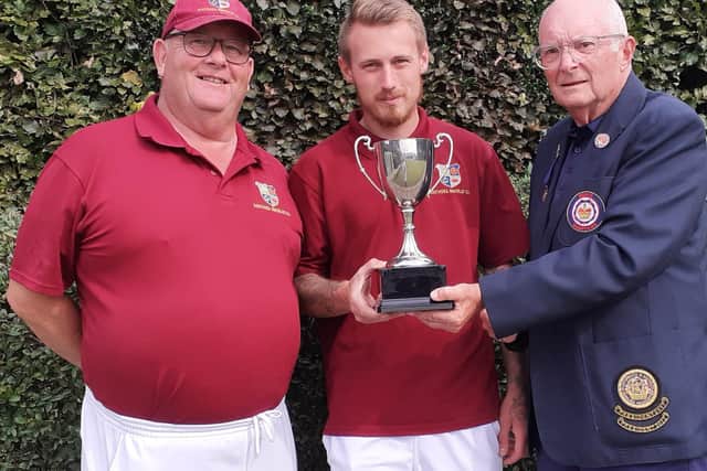 Men's Pairs winners Phil Drewball and Danny Smith, with the P&D President