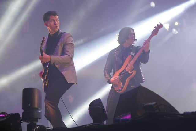 Alex Turner (left) and Nick O'Malley  of the Artic Monkeys performing on the Pyramid Stage, during the first performance day of the Glastonbury 2013 Festival of Contemporary Performing Arts at Pilton Farm, Somerset. Photo: Yui Mok/PA Wire