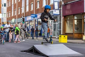 Prajeev Dhayalan (7) rides the scooter ramp provided by Southsea Skate Park at the Feel Good Fratton event. Picture: Mike Cooter (021022)