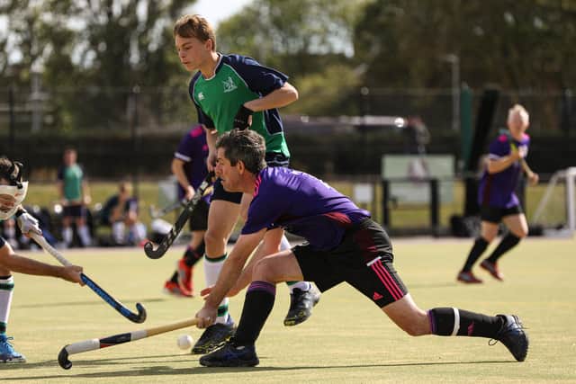Jez Bulled battles for possession during Portsmouth's loss to Sunbury. Picture: Chris Moorhouse