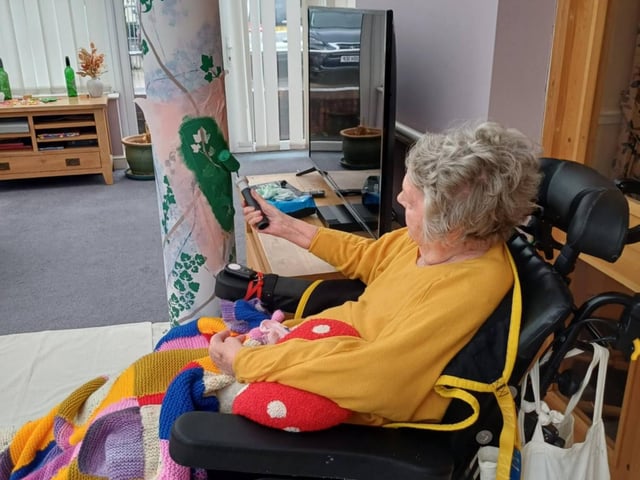 A resident helping to decorate Bedhampton Court, adding a personal finishing touch.